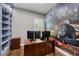 Well-lit office space with custom wallpaper and built-in shelving at 1005 Talon Pl, Winter Springs, FL 32708