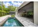 Stunning pool with a spa and an outdoor covered patio with a seating area at 1005 Talon Pl, Winter Springs, FL 32708