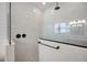 This contemporary shower features sleek marble tiles and elegant black hardware at 1005 Talon Pl, Winter Springs, FL 32708