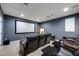 Home theater with reclining leather seats and a large projection screen for immersive entertainment at 1005 Talon Pl, Winter Springs, FL 32708
