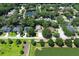 Aerial view of a home in a suburban neighborhood with a pond in the background at 1101 N Division St, Oviedo, FL 32765