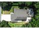Aerial view of home highlighting screened pool, patio, and roof at 1101 N Division St, Oviedo, FL 32765