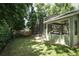 Exterior view of the screened-in porch and pool area from the backyard at 1101 N Division St, Oviedo, FL 32765