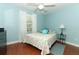 Cozy bedroom with hardwood floors, ceiling fan, and lots of natural light at 1101 N Division St, Oviedo, FL 32765