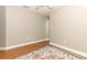 Bare bedroom with hardwood floors, ceiling fan, and electrical outlets at 1101 N Division St, Oviedo, FL 32765
