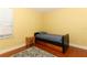 Bright bedroom features a twin bed with wooden floors and a neutral rug at 1101 N Division St, Oviedo, FL 32765
