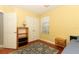 Sunny bedroom with a double closet, natural light, and hardwood floors at 1101 N Division St, Oviedo, FL 32765