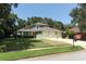 Charming home featuring a three-car garage and well-maintained lawn at 1101 N Division St, Oviedo, FL 32765