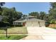 Charming two-story home featuring a three-car garage and a well-manicured lawn with mature landscaping at 1101 N Division St, Oviedo, FL 32765
