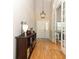 A bright foyer features wood floors and views into the living room at 1101 N Division St, Oviedo, FL 32765