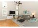 Comfortable living room with vaulted ceiling, recessed lights, contemporary decor, and entertainment center at 1101 N Division St, Oviedo, FL 32765