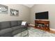 Comfortable living room with a TV and views into another room at 1101 N Division St, Oviedo, FL 32765