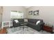 Cozy living room with a large window and comfortable seating area at 1101 N Division St, Oviedo, FL 32765