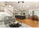 Open-concept living space featuring the kitchen, dining area, and living room with vaulted ceilings at 1101 N Division St, Oviedo, FL 32765