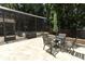 Outdoor patio with table and chairs surrounded by a screened enclosure at 1101 N Division St, Oviedo, FL 32765