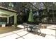 Screened-in pool with brick patio, outdoor seating, and mature trees at 1101 N Division St, Oviedo, FL 32765