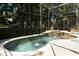 Screened-in pool with spa features fountains and brick patio at 1101 N Division St, Oviedo, FL 32765