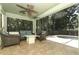 Screened-in porch features outdoor seating and a hot tub at 1101 N Division St, Oviedo, FL 32765