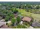 Charming home situated with a view of the golf course, complemented by mature trees and lush green surroundings at 1139 Fairway Dr, Winter Park, FL 32792