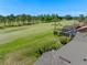 Aerial view of the property showcasing a lush green golf course, pool, and lanai at 1139 Fairway Dr, Winter Park, FL 32792