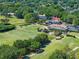 Birds-eye-view of the community with golf range, lush fairways, putting greens and mature trees at 1139 Fairway Dr, Winter Park, FL 32792