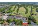 Aerial view of a golf course, featuring lush greenery, water features, and a clubhouse at 1139 Fairway Dr, Winter Park, FL 32792