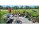 Backyard view with patio and seating, a view of the golf course, and mature landscaping at 1139 Fairway Dr, Winter Park, FL 32792