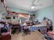 Craft room featuring a sewing machine, ironing board, shelves and lots of storage at 1139 Fairway Dr, Winter Park, FL 32792