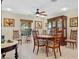 Dining area featuring a wood table set, china cabinet, and natural light from the window at 1139 Fairway Dr, Winter Park, FL 32792