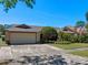 Charming home featuring a stone accent garage, well maintained lawn, and mature trees at 1139 Fairway Dr, Winter Park, FL 32792