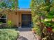 Inviting walkway to the front door surrounded by lush greenery and foliage at 1139 Fairway Dr, Winter Park, FL 32792