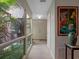 Bright hallway with natural light from the atrium and neutral decor at 1139 Fairway Dr, Winter Park, FL 32792