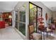 Bright hallway with tiled floors with a view into a living area at 1139 Fairway Dr, Winter Park, FL 32792