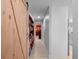 Hallway featuring a sliding barn door, built-in shelving, and access to additional rooms at 1139 Fairway Dr, Winter Park, FL 32792