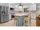 Bright kitchen featuring stainless steel appliances, an island, and white cabinets at 1139 Fairway Dr, Winter Park, FL 32792