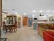 Open floor plan with dining area flowing into a modern kitchen and living space at 1139 Fairway Dr, Winter Park, FL 32792