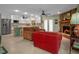 Open concept living space with fireplace, kitchen and comfortable seating area at 1139 Fairway Dr, Winter Park, FL 32792