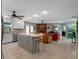 Open concept kitchen and living room with fireplace and tile flooring at 1139 Fairway Dr, Winter Park, FL 32792