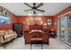 Spacious main bedroom with decorative furniture, ceiling fan, and ensuite bathroom at 1139 Fairway Dr, Winter Park, FL 32792