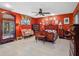 Charming main bedroom featuring ornate furniture, seating area, and ceiling fan at 1139 Fairway Dr, Winter Park, FL 32792
