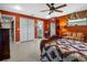 Main bedroom with a seating area, decorative furniture, and closet doors at 1139 Fairway Dr, Winter Park, FL 32792