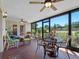 Relaxing sunroom with brick flooring, ceiling fans, patio furniture, and views of the outdoor landscape at 1139 Fairway Dr, Winter Park, FL 32792