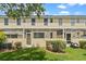 Charming view of backyard patio, and well-maintained lawn and landscaping at 1236 S Beach Cir, Kissimmee, FL 34746