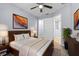 Bedroom featuring modern décor, a ceiling fan, a walk-in closet, and a wooden bed frame at 1236 S Beach Cir, Kissimmee, FL 34746