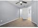 Bedroom with a light-grey wall color and white trim featuring a walk-in closet and an ensuite doorway at 1236 S Beach Cir, Kissimmee, FL 34746