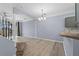 Open concept dining room features new hardwood floors and archway at 1236 S Beach Cir, Kissimmee, FL 34746