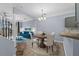 Open-concept dining area with a view into the living room at 1236 S Beach Cir, Kissimmee, FL 34746