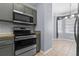 Kitchen featuring modern appliances, stylish cabinets, and ample counter space at 1236 S Beach Cir, Kissimmee, FL 34746
