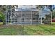 Beautiful screened-in pool and backyard oasis with lush greenery at 130 Circle Hill Rd, Sanford, FL 32773