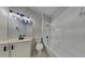 Bright bathroom with modern fixtures, a soaking tub, and tiled walls at 130 Circle Hill Rd, Sanford, FL 32773